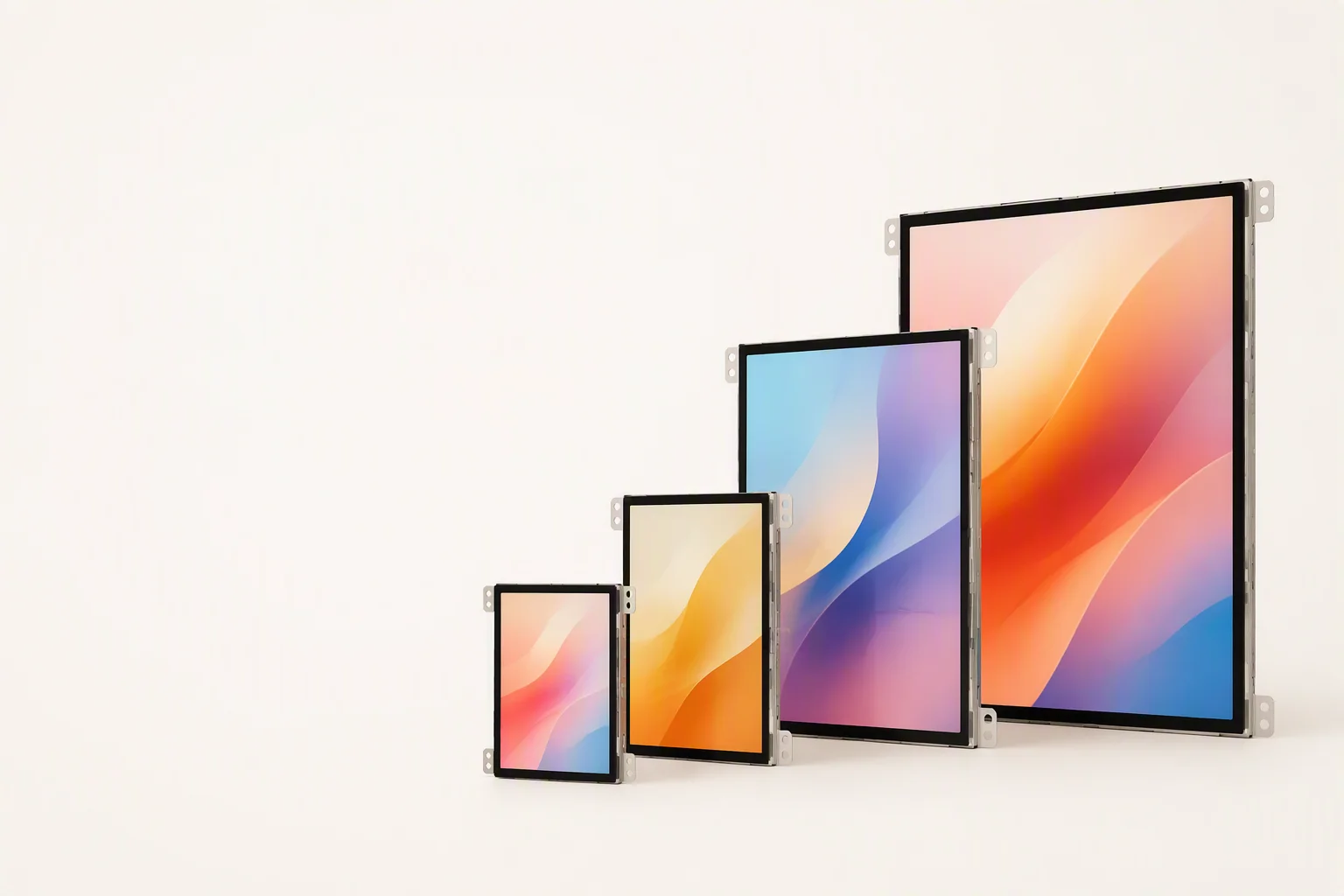 TFT-LCD modules in 2.4, 3.5, 7 and 10.1 inch sizes standing upright showing bright IPS screens on a white studio background